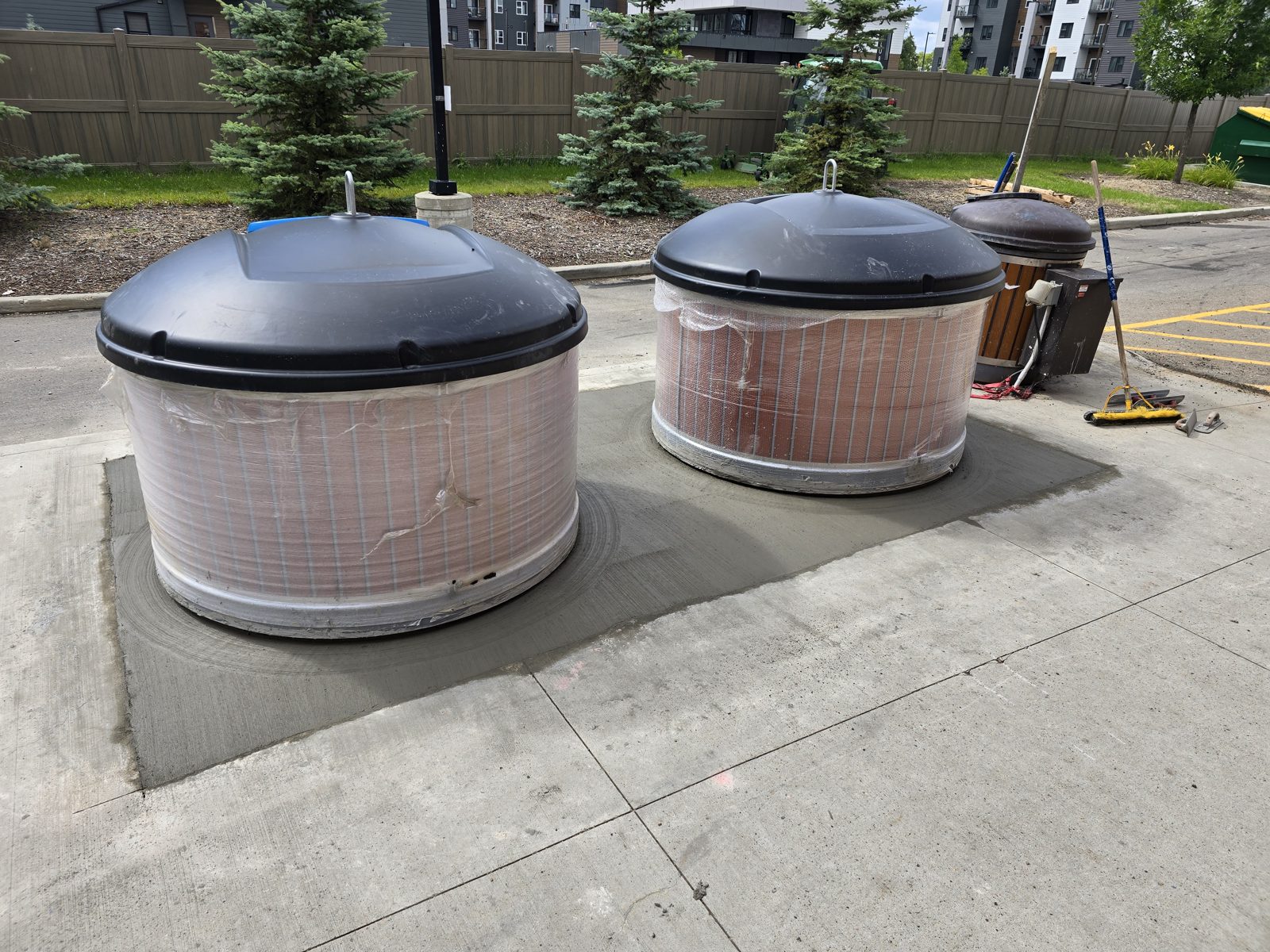 Commercial concrete pads poured around tanks in Edmonton