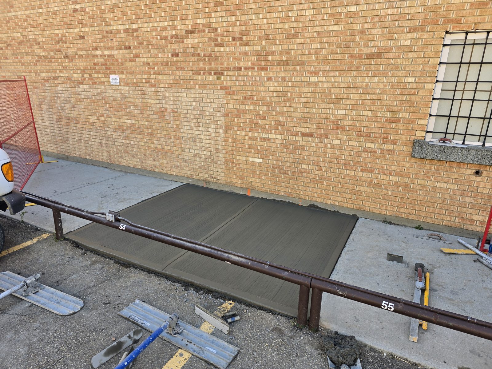 New concrete slab against a brick wall — DM Contracting Edmonton